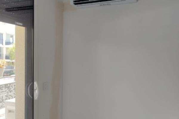 Installation discrète d'un Trisplit  par Clim'Kong Services